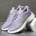 Women's Lavender Purple Flyknit running shoes with mesh detailing and a striped pattern on a white background.
