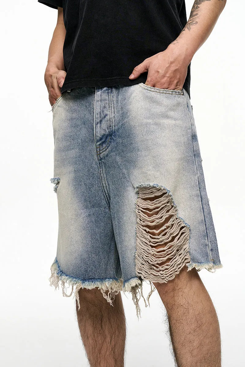 Light blue retro washed men's baggy denim shorts on a mid-rise mannequin, showing wide-leg cut.