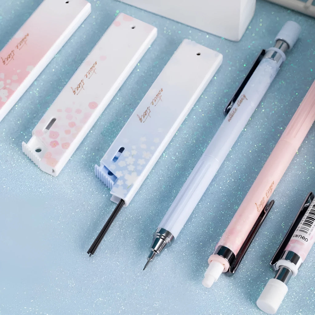 Cartoon sakura design automatic pencil set with three pencils and boxes of HB refills.