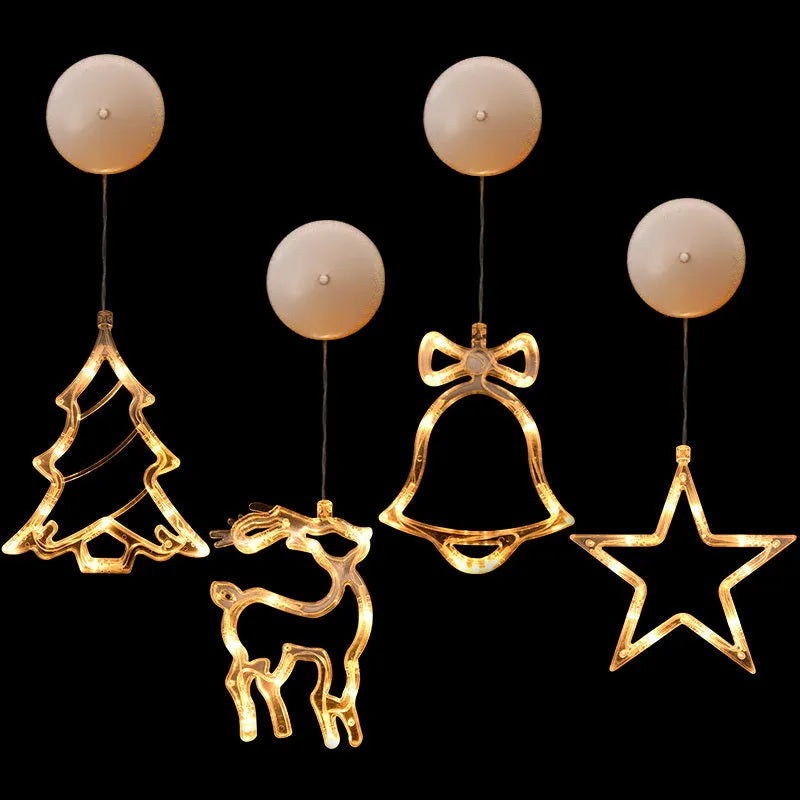 Battery powered LED decorative light with suction cups showing Santa Claus and snowman designs on a window.
