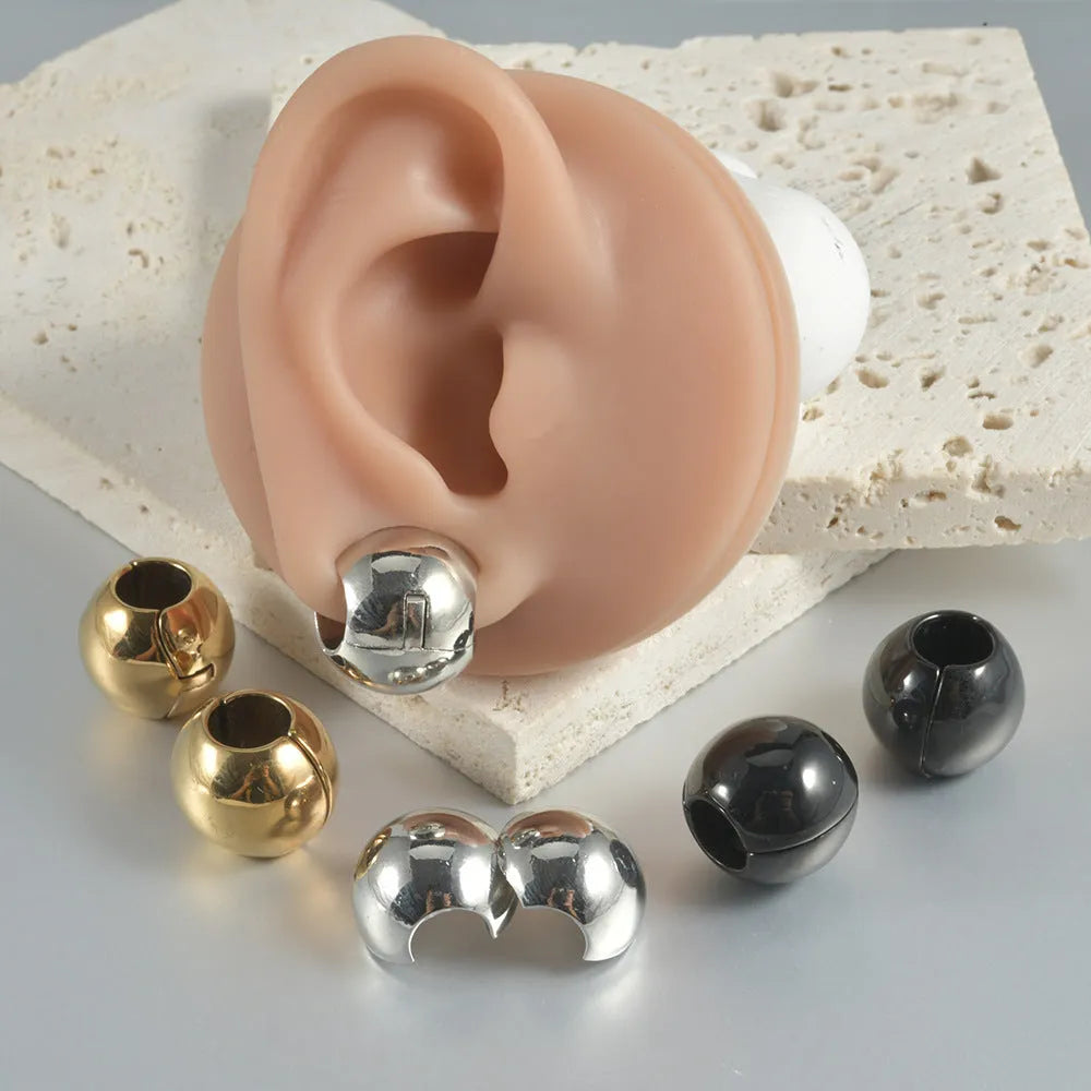 Stainless steel hollow skull and Buddha head design earrings in four colour options.