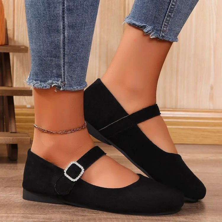 Women's solid black casual flat fisherman shoes with canvas upper and rubber sole.