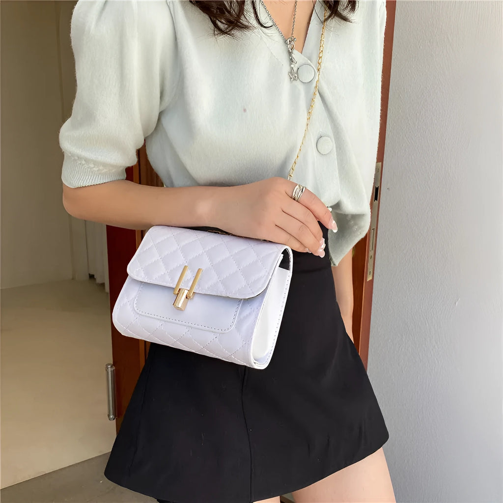 Women's diamond lattice pattern crossbody bag with adjustable strap in black colour