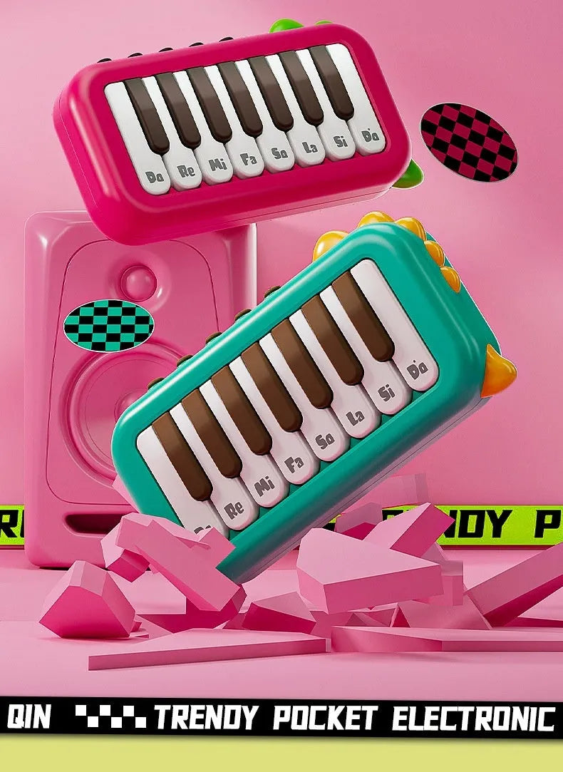 Pocket electronic keyboard little piano pattern toy for children in green and pink plastic.
