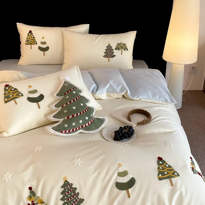 Pure cotton duvet cover and pillowcase set with raised embroidered Christmas tree and floral design in green and cream.