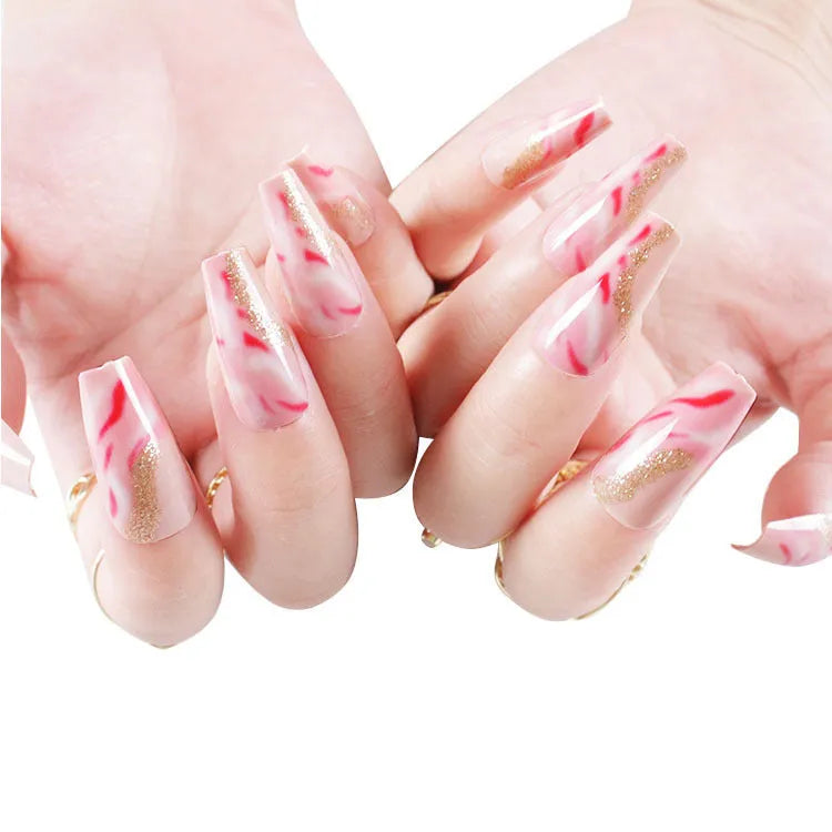 One Second Wearable Manicure set showing 24 blush-coloured false nails with rose, tulip, leopard print, and XINGX patterns and glue.