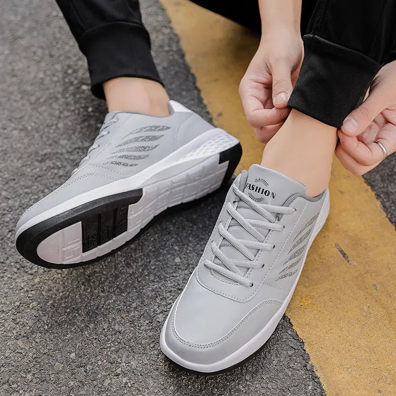 Men's black low-top sneakers with breathable mesh inner, synthetic PU upper, rubber sole, front lacing, sizes 38-48