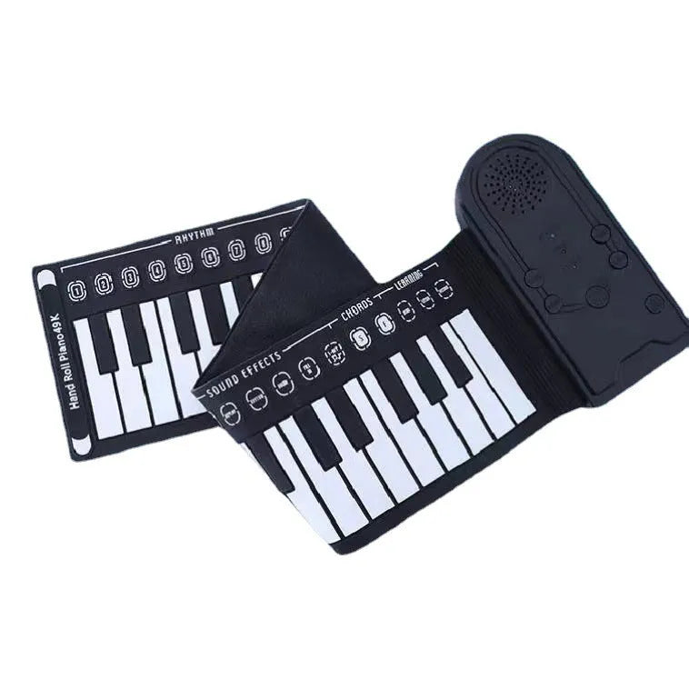 Pearlescent white portable electronic keyboard with 49 silicone keys, rolled up next to its compact ABS plastic control unit.