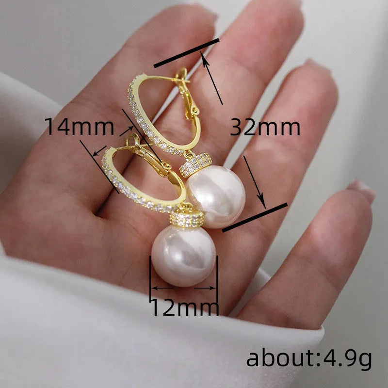 Yellow gold copper earrings with imitation pearl and zircon inlay geometric round ring style