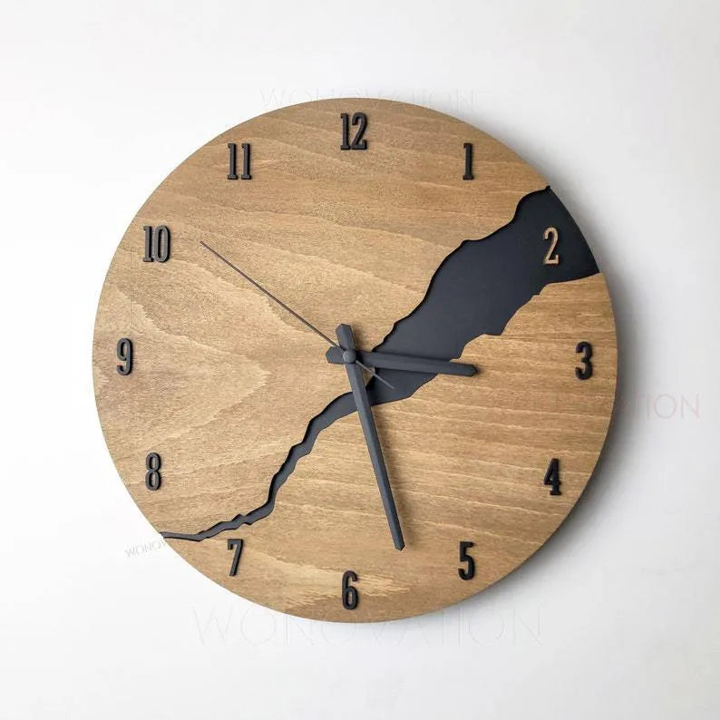 Modern wooden wall clock with creative crack design on a white wall.