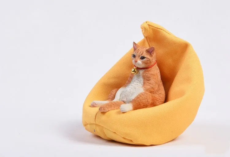 Small lazy cat figurine with miniature sofa car dashboard ornament