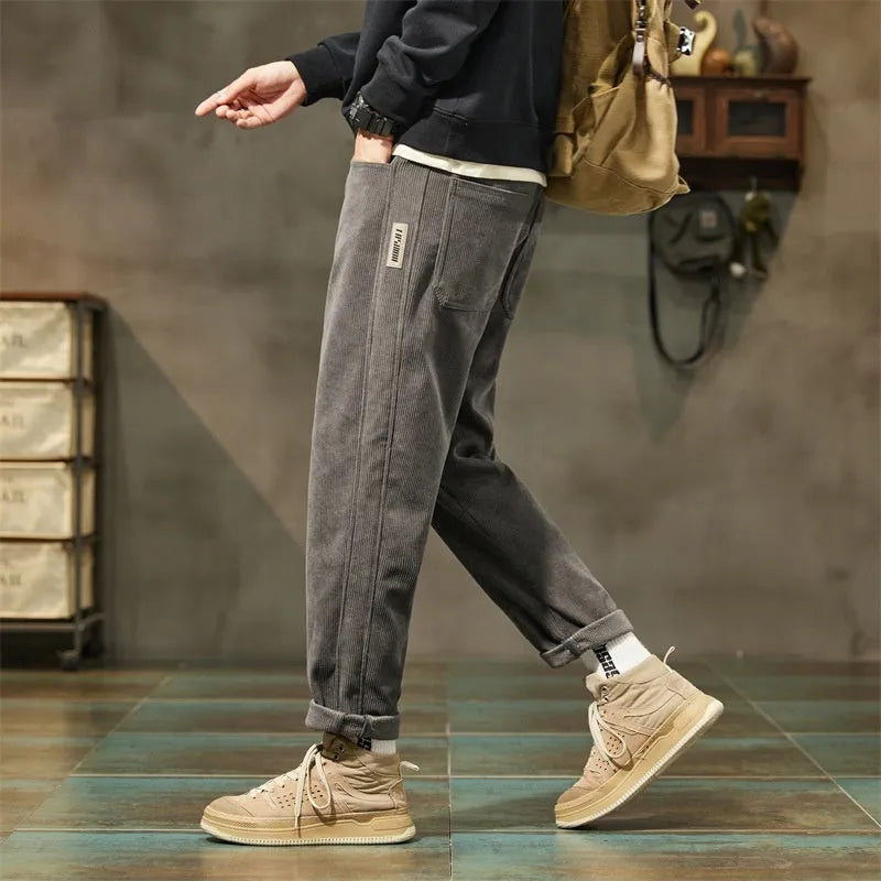 Corduroy men's straight-leg casual trousers in tapered street fashion style with mid-waist design