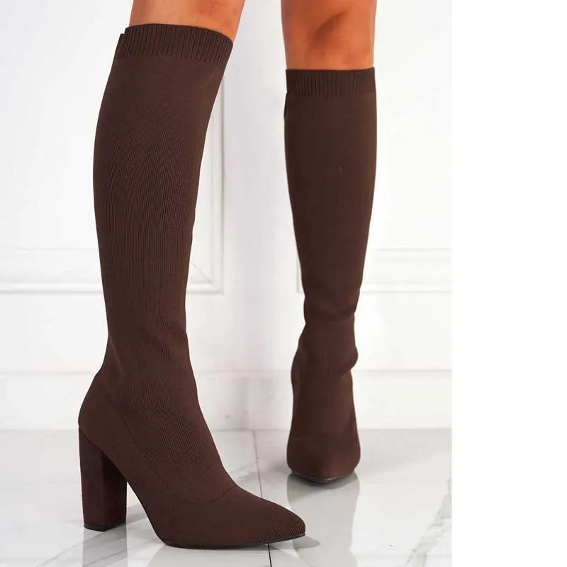 Women's thick high-heel thigh boots in solid black colour with PU upper and super high heel above 8cm