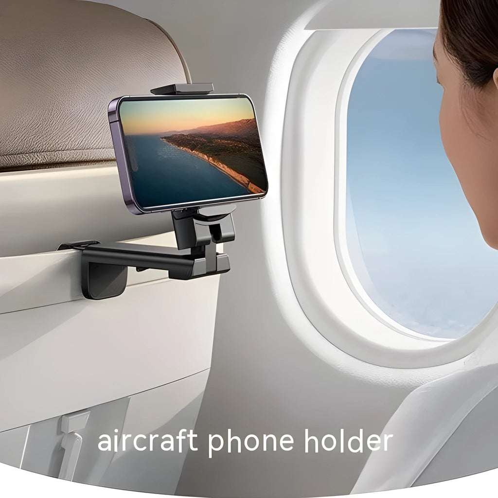Foldable rotating universal phone holder in black on a desk next to a mobile phone.