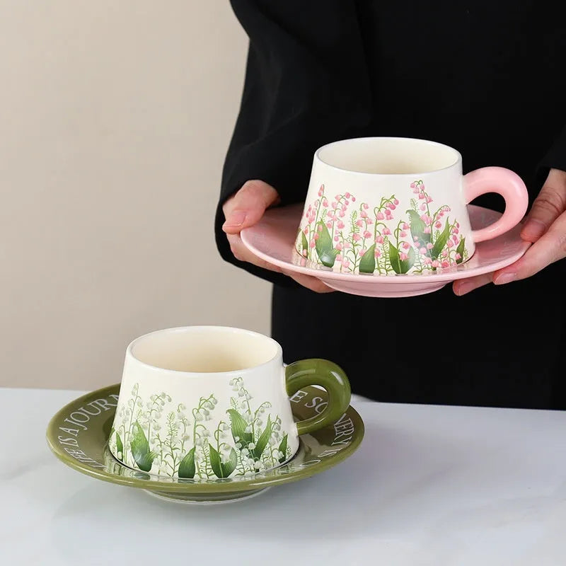 Ceramic coffee cup and saucer set with two mugs, two saucers and two stirring spoons