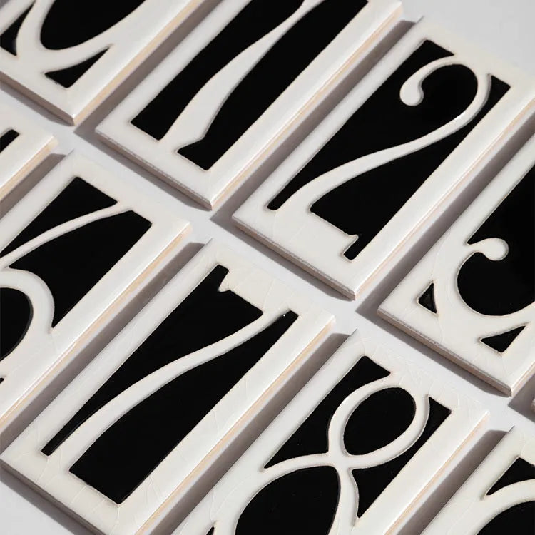 Handmade retro-style ceramic doorplate with glossy enamel number, shown at 76mm by 152mm size.