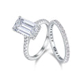 Pair of matching geometric S925 sterling silver rings with white finish on a flat surface