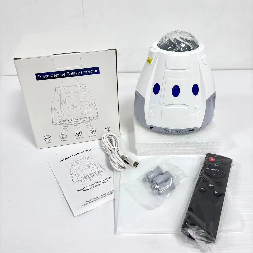 Compact white cube-shaped USB galaxy projection lamp with remote control on a table