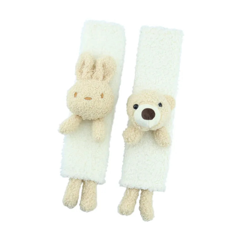 Cartoon plush lamb wool seat belt shoulder protector cover in Bear design on a car seat.