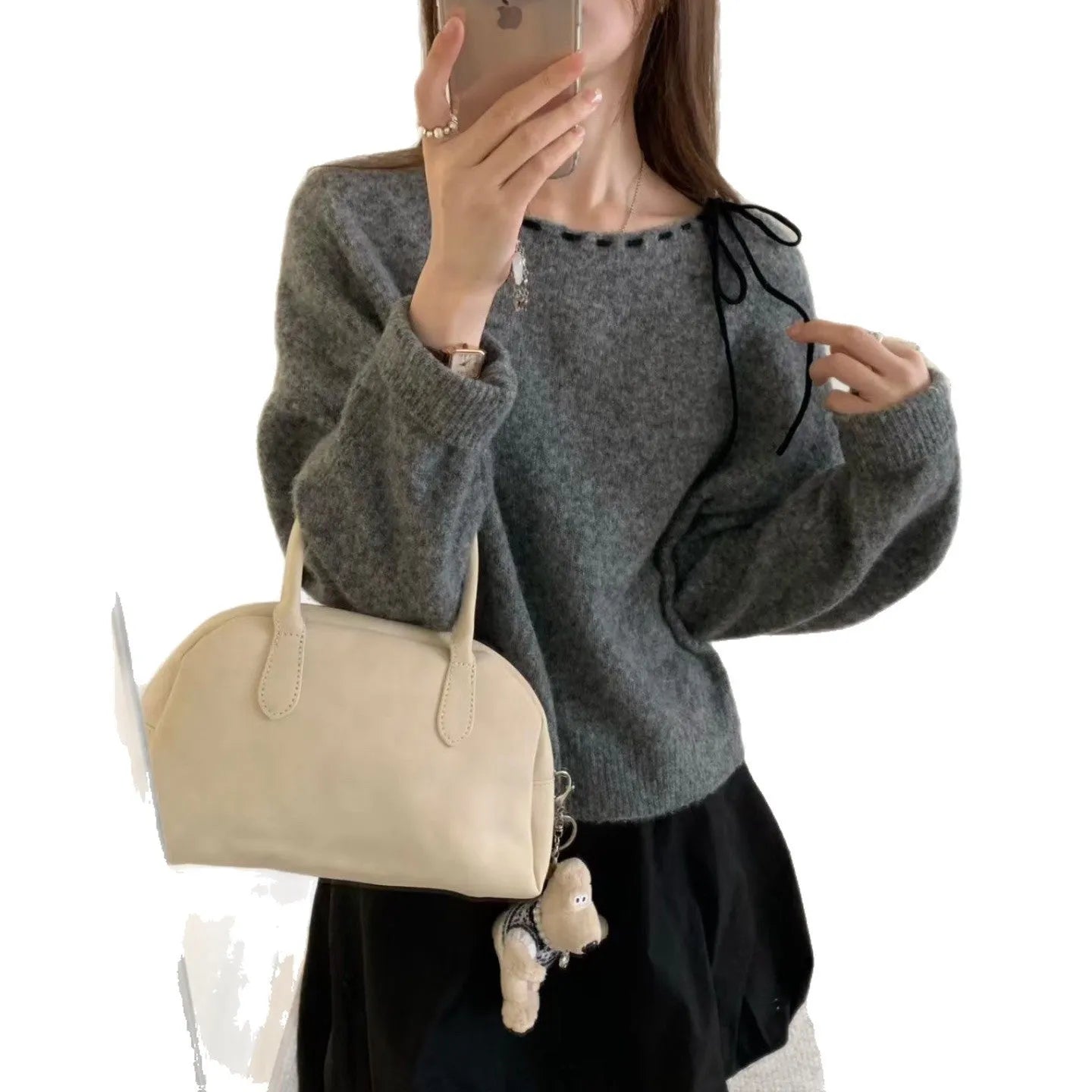Grey loose-fitting women's long sleeve pullover made from regenerated cellulose knitwear.