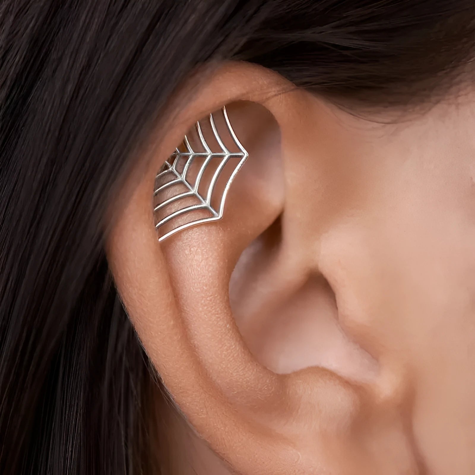 Geometric spider web metal stud earrings with electroplated gold and silver finish options