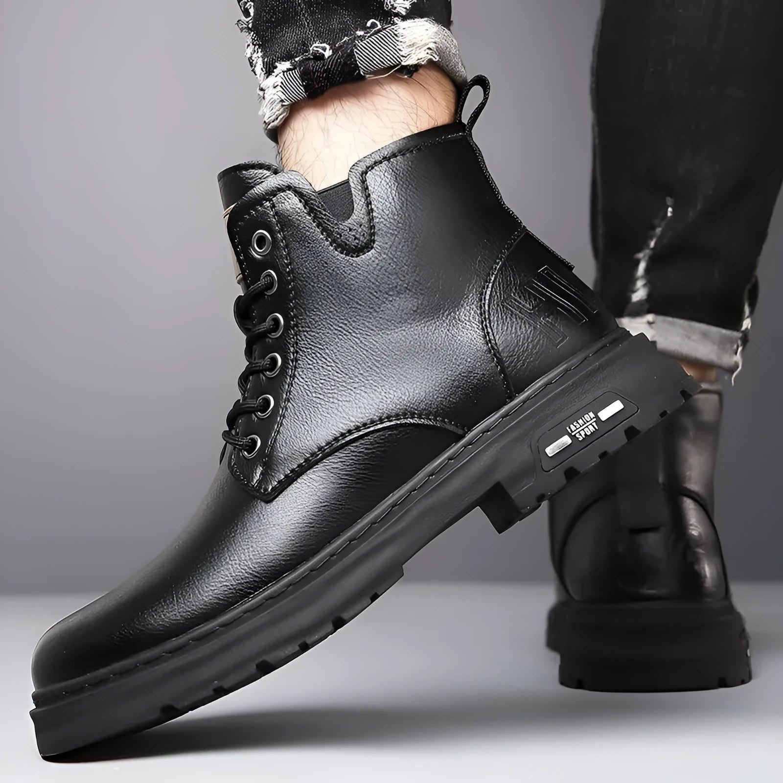 Men's black lace-up work boots with round toe and thick rubber sole for outdoor use