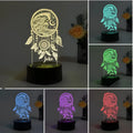 Modern black and clear acrylic dream catcher night light with remote control on a table.