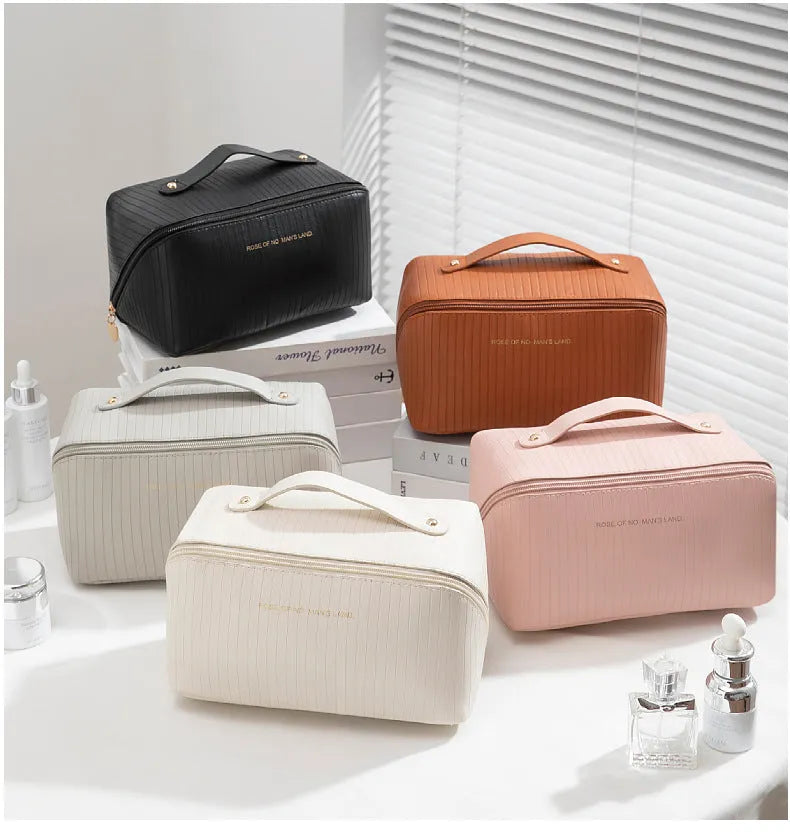 Vertical pattern cubic PU makeup bag in beige, showing large capacity for travel storage.