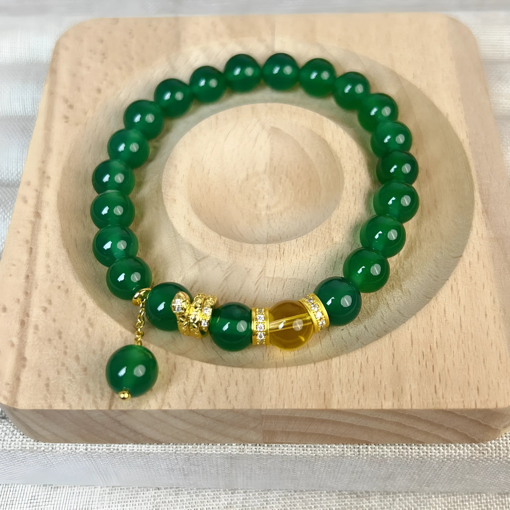 Handcrafted green chalcedony wealth snake and red agate beaded bracelet with copper components.
