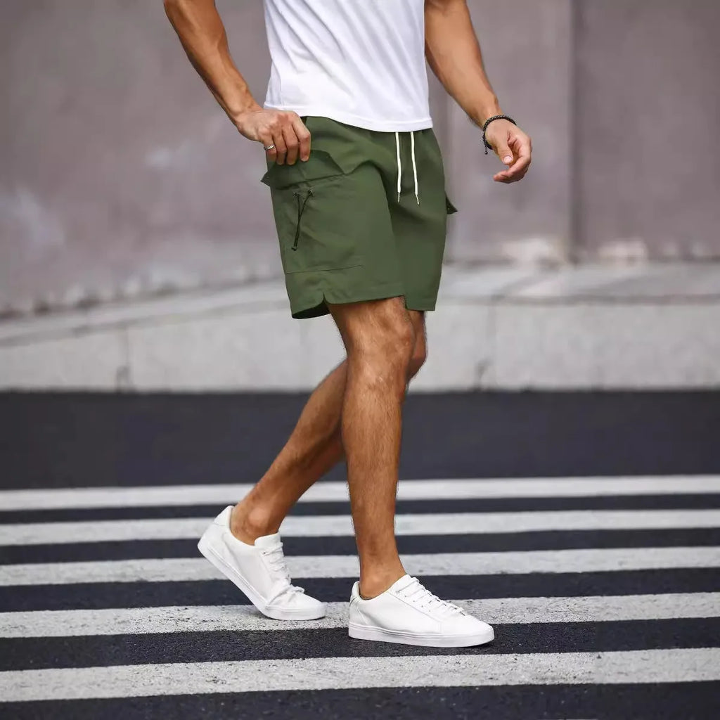 Men's loose-fitting straight-leg work shorts in fluorescent green cool silk cotton fabric.