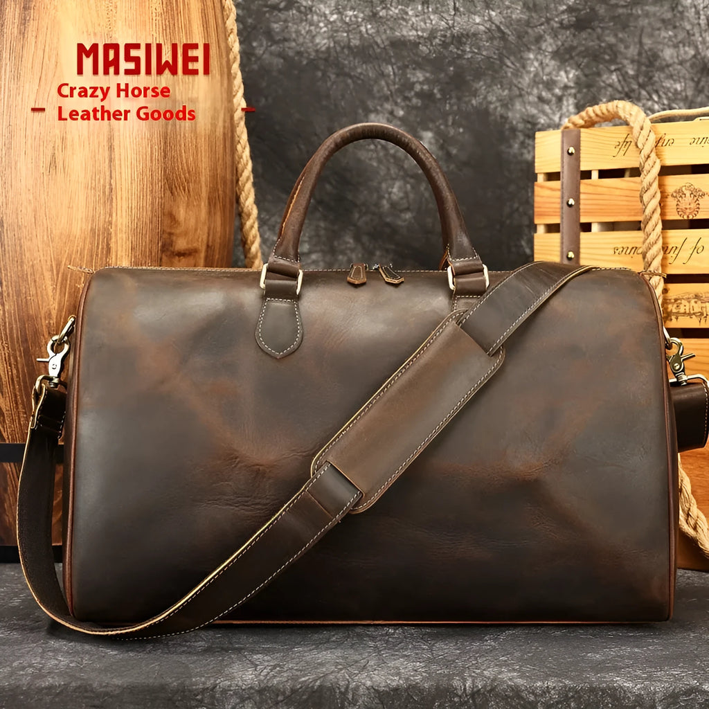 Men's large vintage genuine leather crossbody bag in black, shown with dimensions 48.3cm wide by 25cm deep.