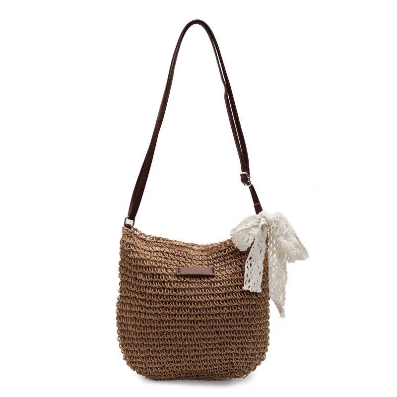 Women's woven straw messenger bag with hollowed pattern in khaki colour with zipper compartment