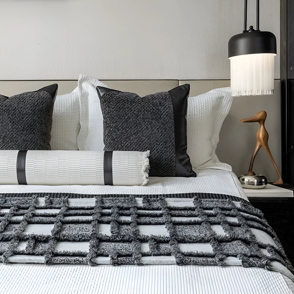 Modern grey and white plaid bed runner blanket and pillow set arranged on a double bed