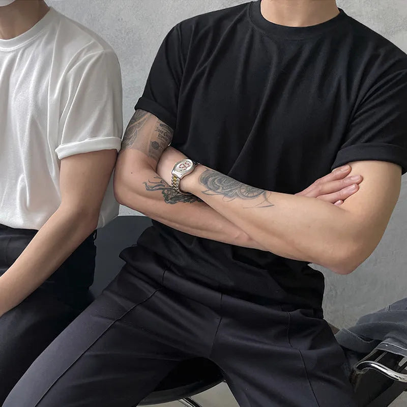 Men's slim fit cotton t-shirt in black on a hanger, showing round neck and short sleeve.