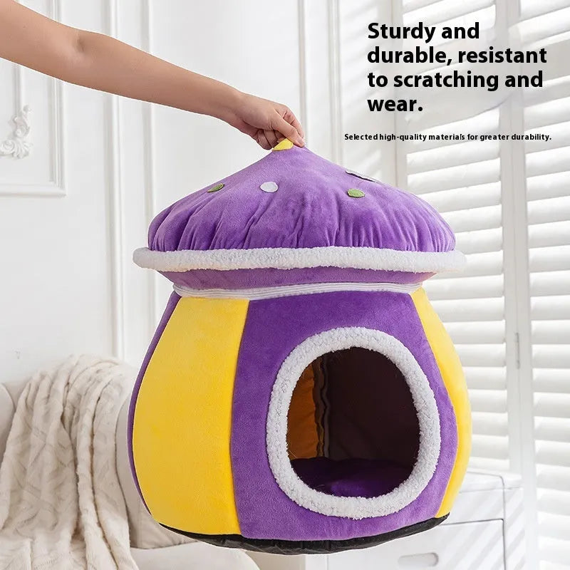 Grey mushroom-shaped plush cat bed with a detachable blanket inside, shown on a wooden floor.