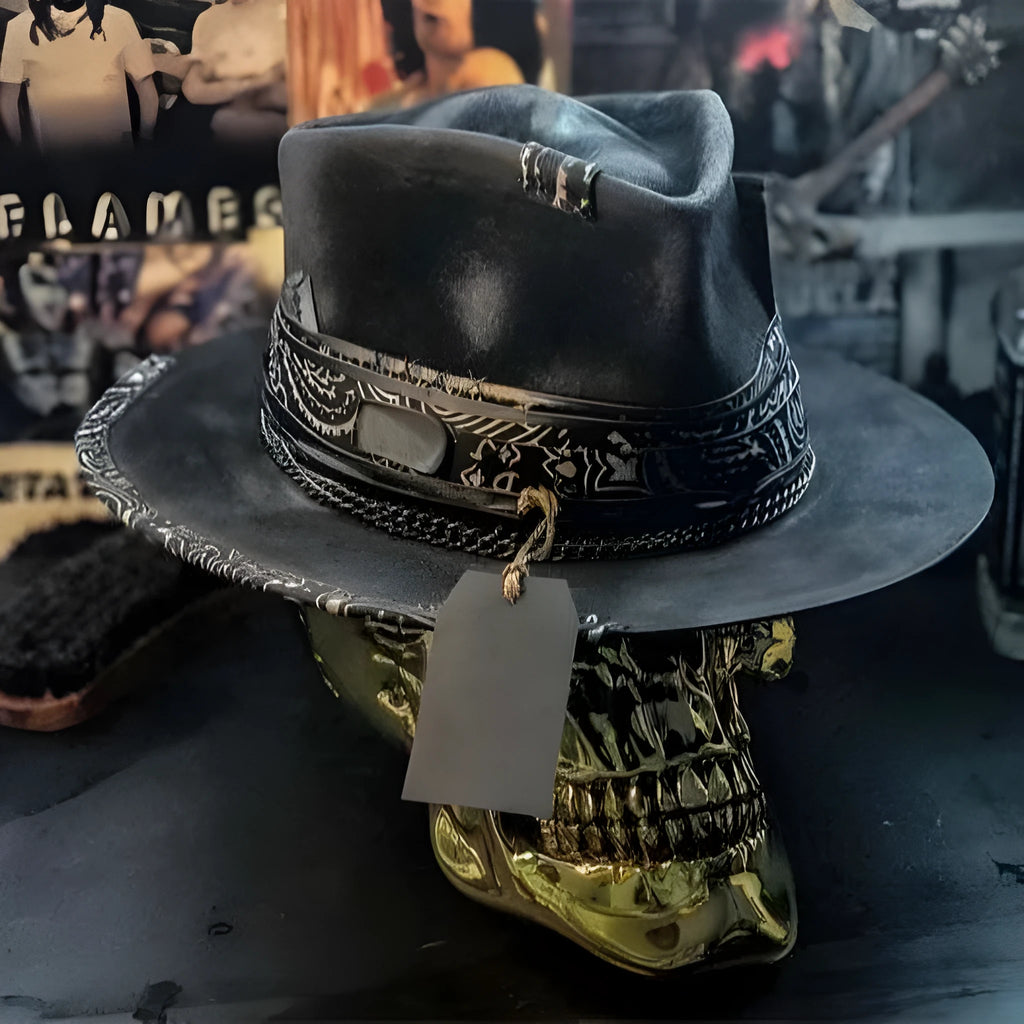 Handmade conical skull hat in wool felt and denim, shown from the side, highlighting its structured crown shape.
