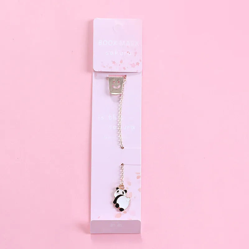 Alloy metal bookmark with cartoon pendant designs including panda, rocket and unicorn variations