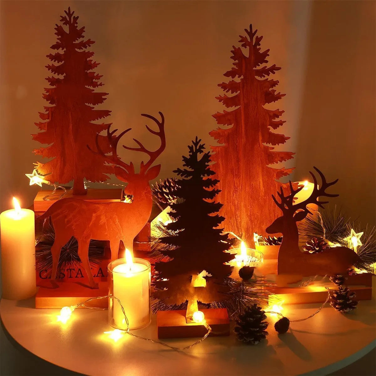 Three rusty metal elk Christmas tree ornaments with American-style design on green branches