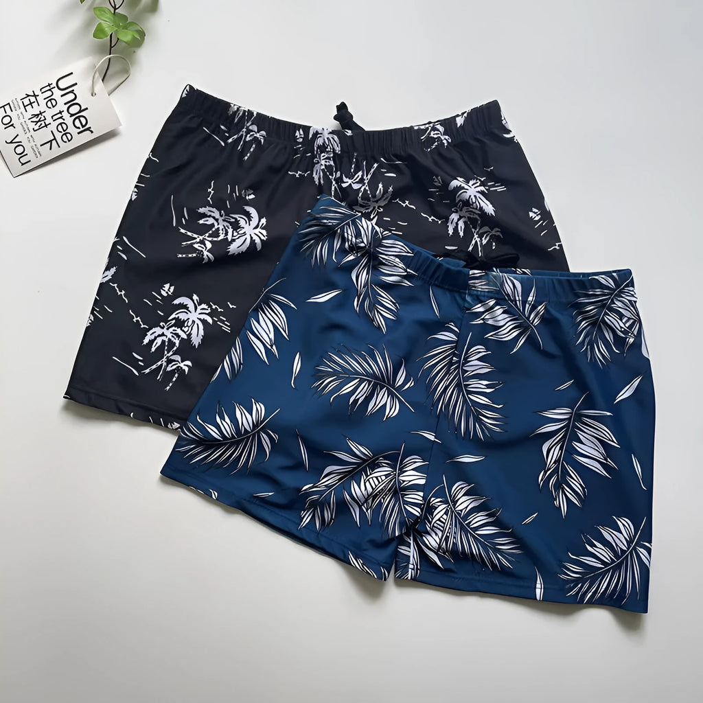 Men's loose fit anti-embarrassment swimming trunks in dark blue background large flower pattern, polyester fabric
