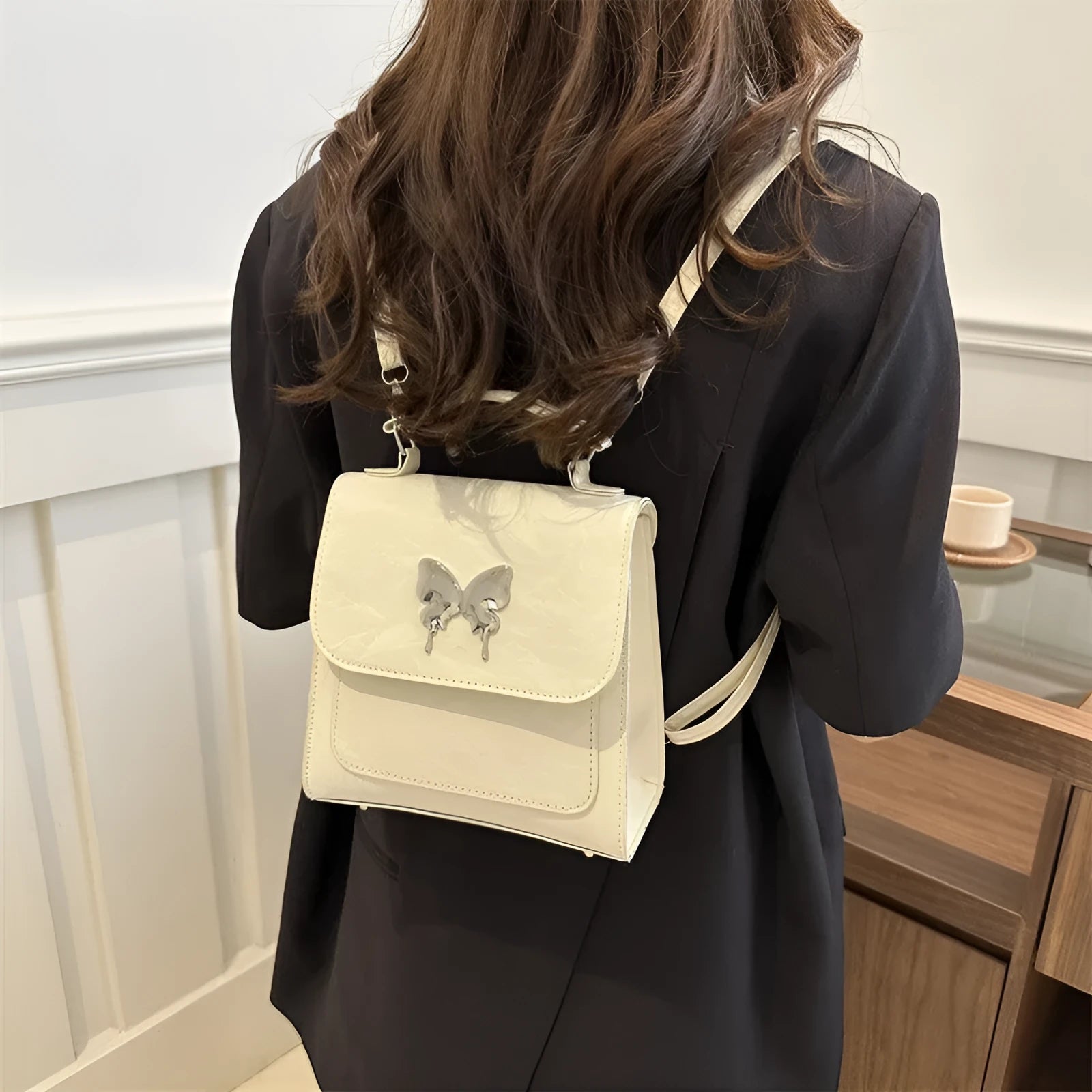 Women's white PU leather hand-carry backpack with bow detail and mobile phone compartment