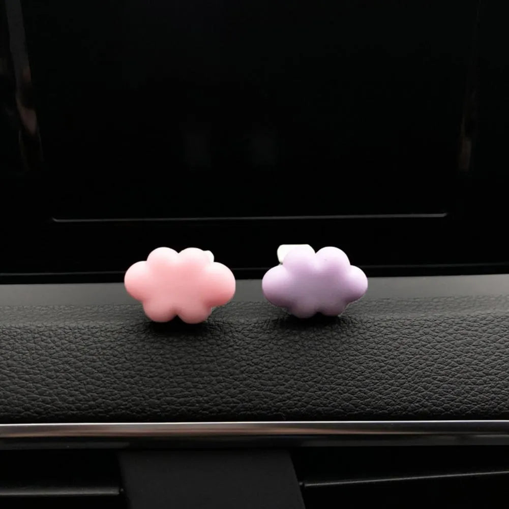 Resin Baiyun cartoon car air freshener clip in six colours on a car vent.