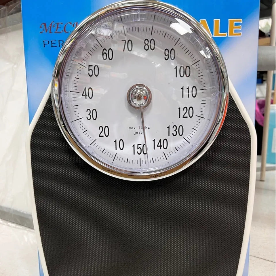 Black mechanical bathroom scale with large dial on a 47x35cm platform.