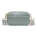 Women's cross-body bag in black, urban simplicity style, with visible sewing thread and sandwich pocket on front.