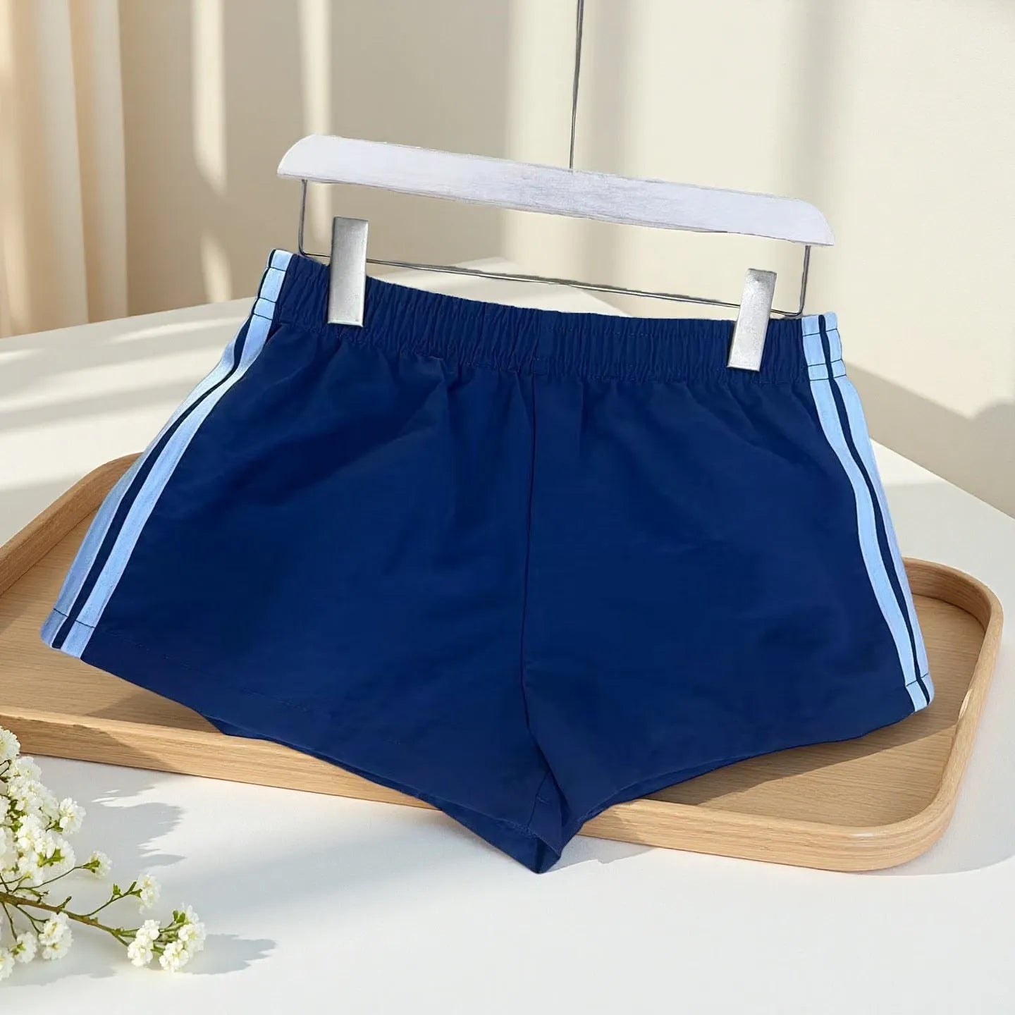 Men's navy blue high waist nylon sports shorts with micro elasticity on a white background