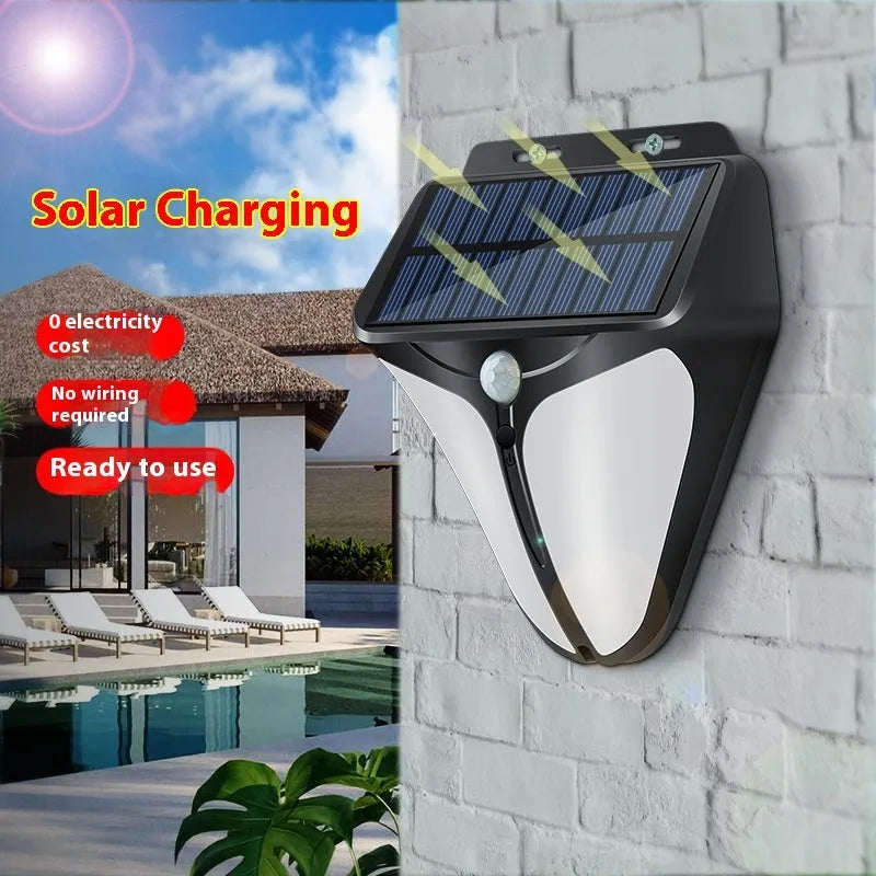 Heart shaped human induction solar wall lamp with binocular lights on an exterior wall in a villa courtyard