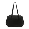 Women's square PU tote bag in black with double straps, showing external sandwich pocket and sewing line detail.
