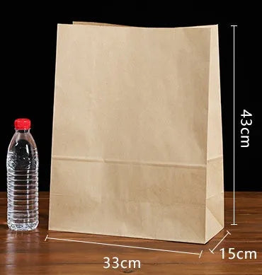 Yellow kraft paper tin foil bag with inner aluminium layer for snack food packaging.