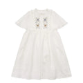White cotton girls dress with embroidered ruffles, short sleeves, solid colour A-line shape