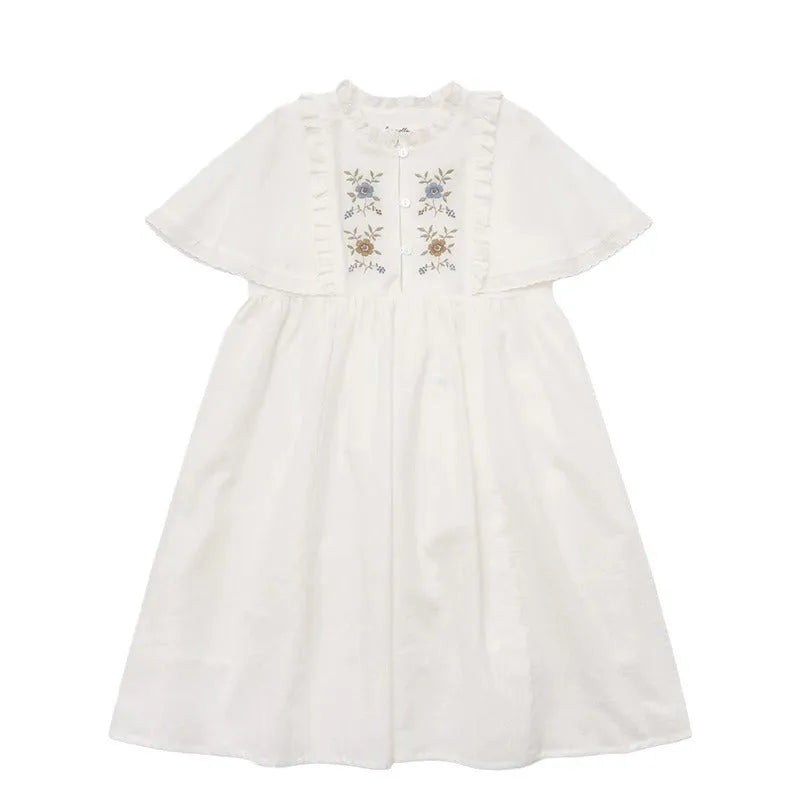 White cotton girls dress with embroidered ruffles, short sleeves, solid colour A-line shape