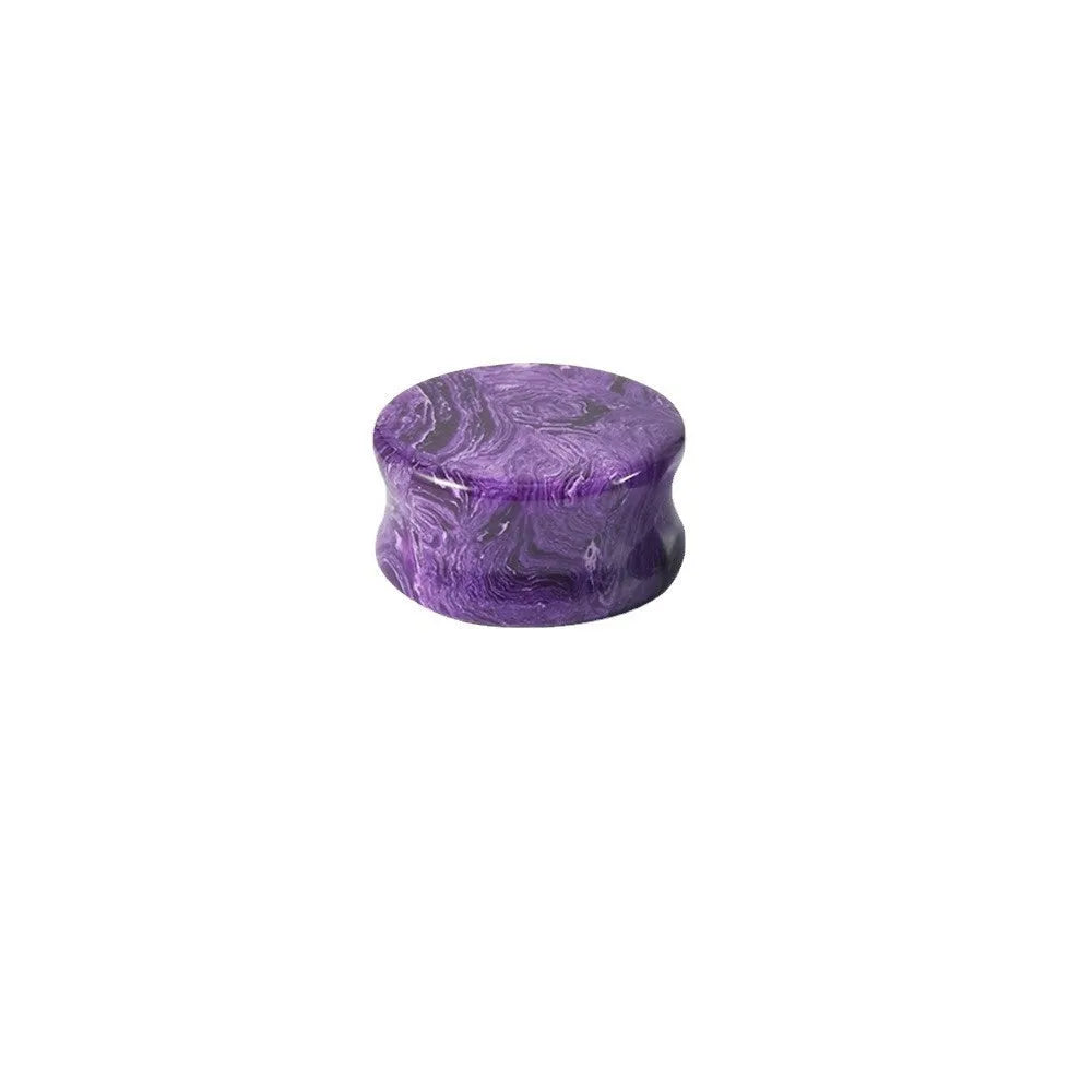 Crystal red flower stone solid expansion earplug on grey background, 6mm to 30mm sizes available, unisex geometric design